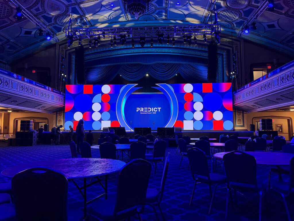 Recorded Future Predict 2025 keynote presentation design on a large event screen in New York