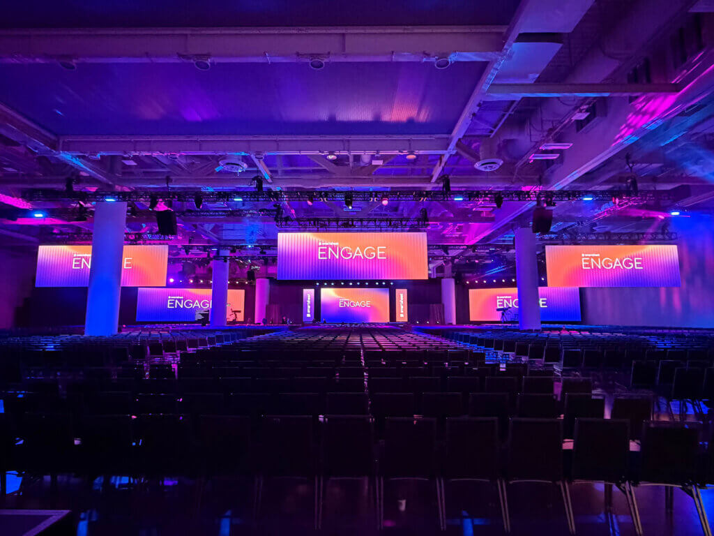 Smartsheet Engage 2025 event presentation design displayed on stage in Seattle